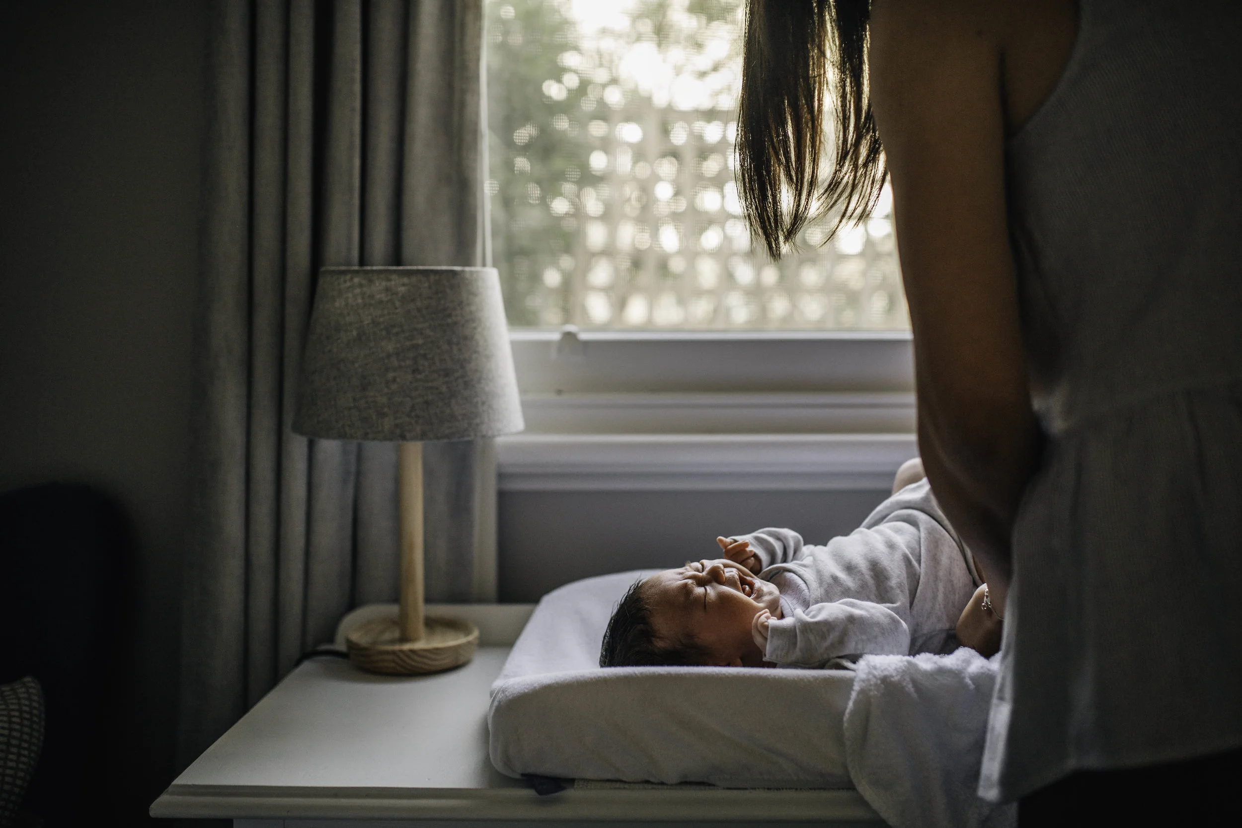 baby-on-changetable-in-window-light.jpg