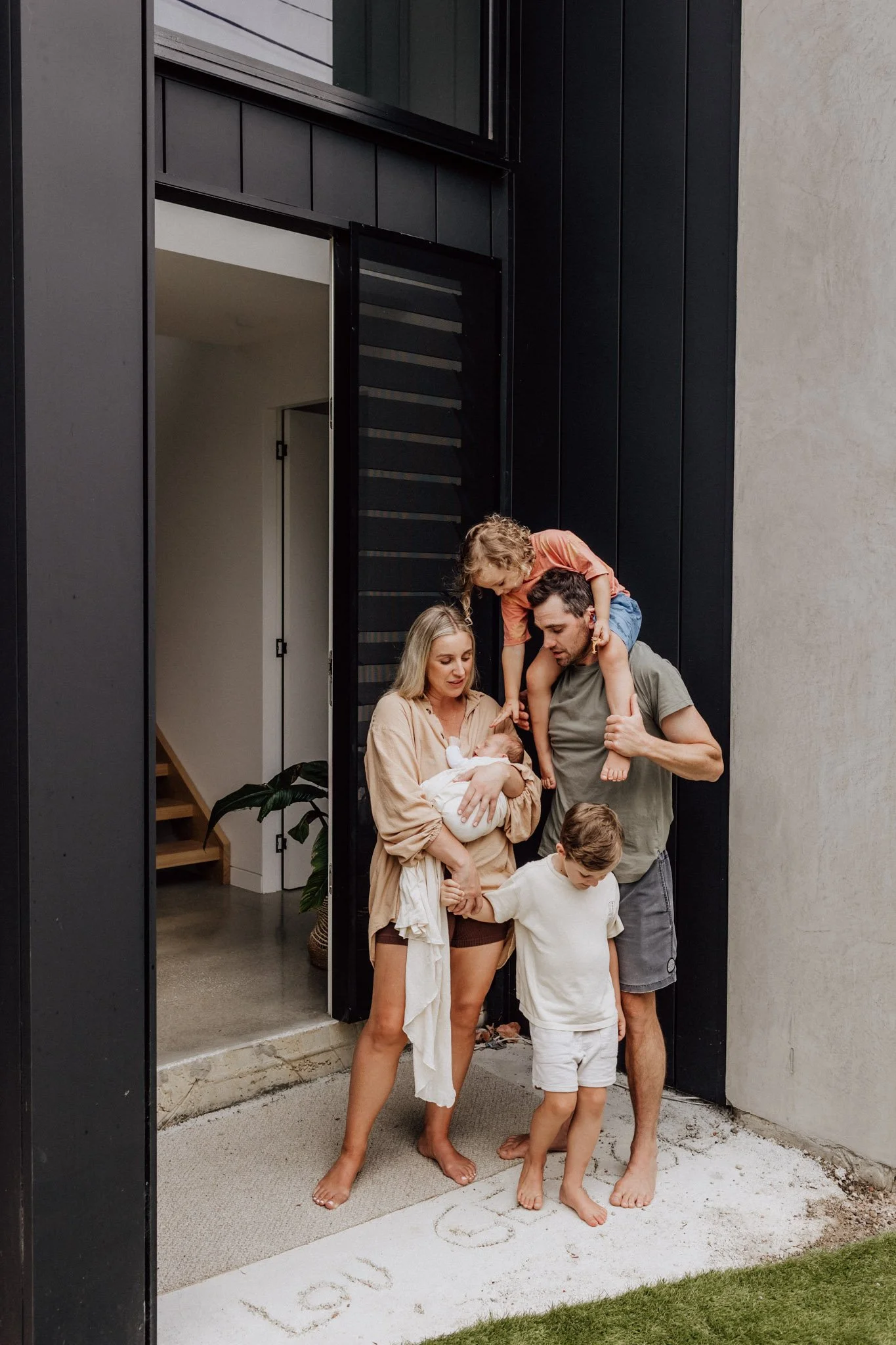 geelong family at front door of their home