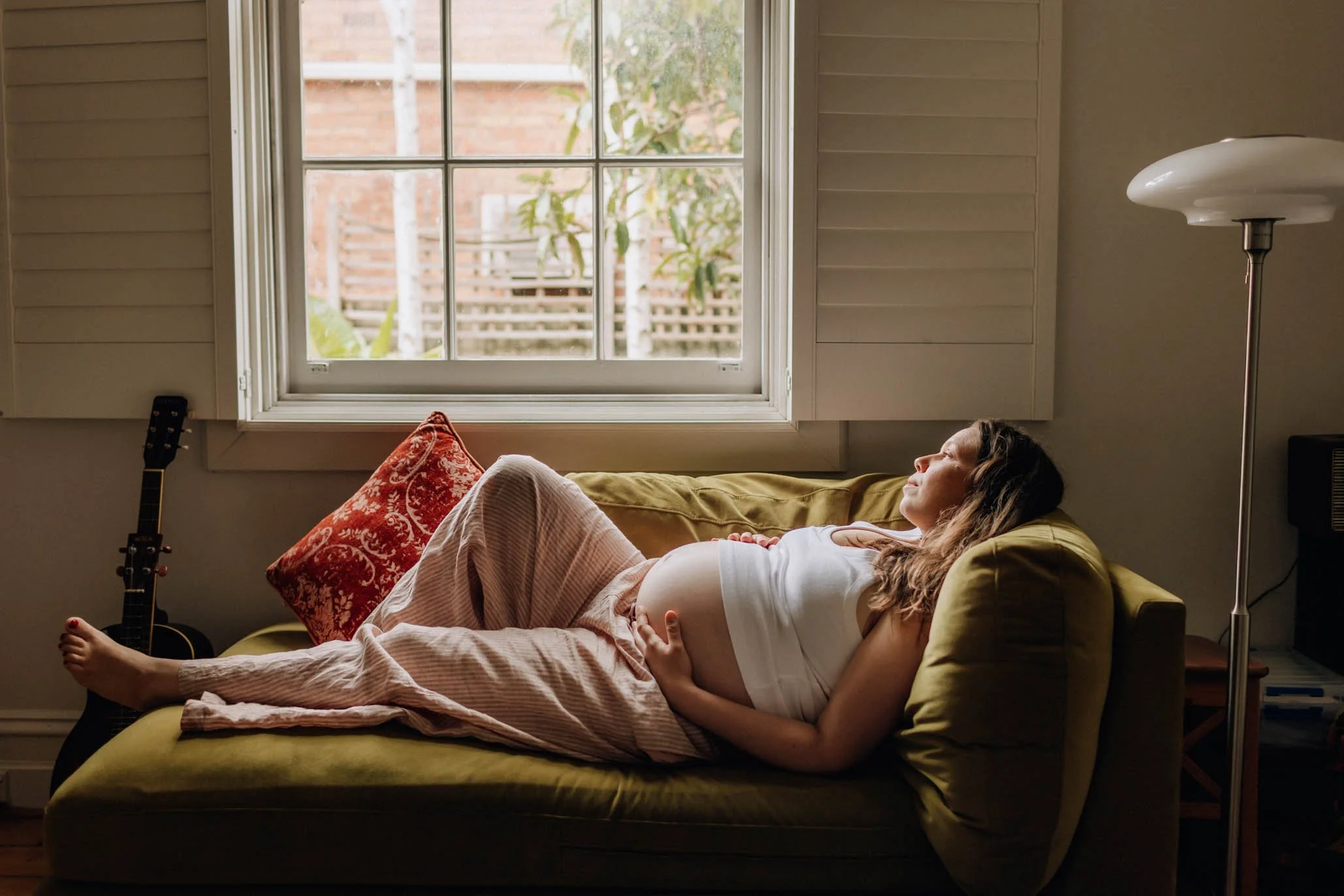 pregnant mother relaxing for natural in home maternity photography session in ballarat.jpg