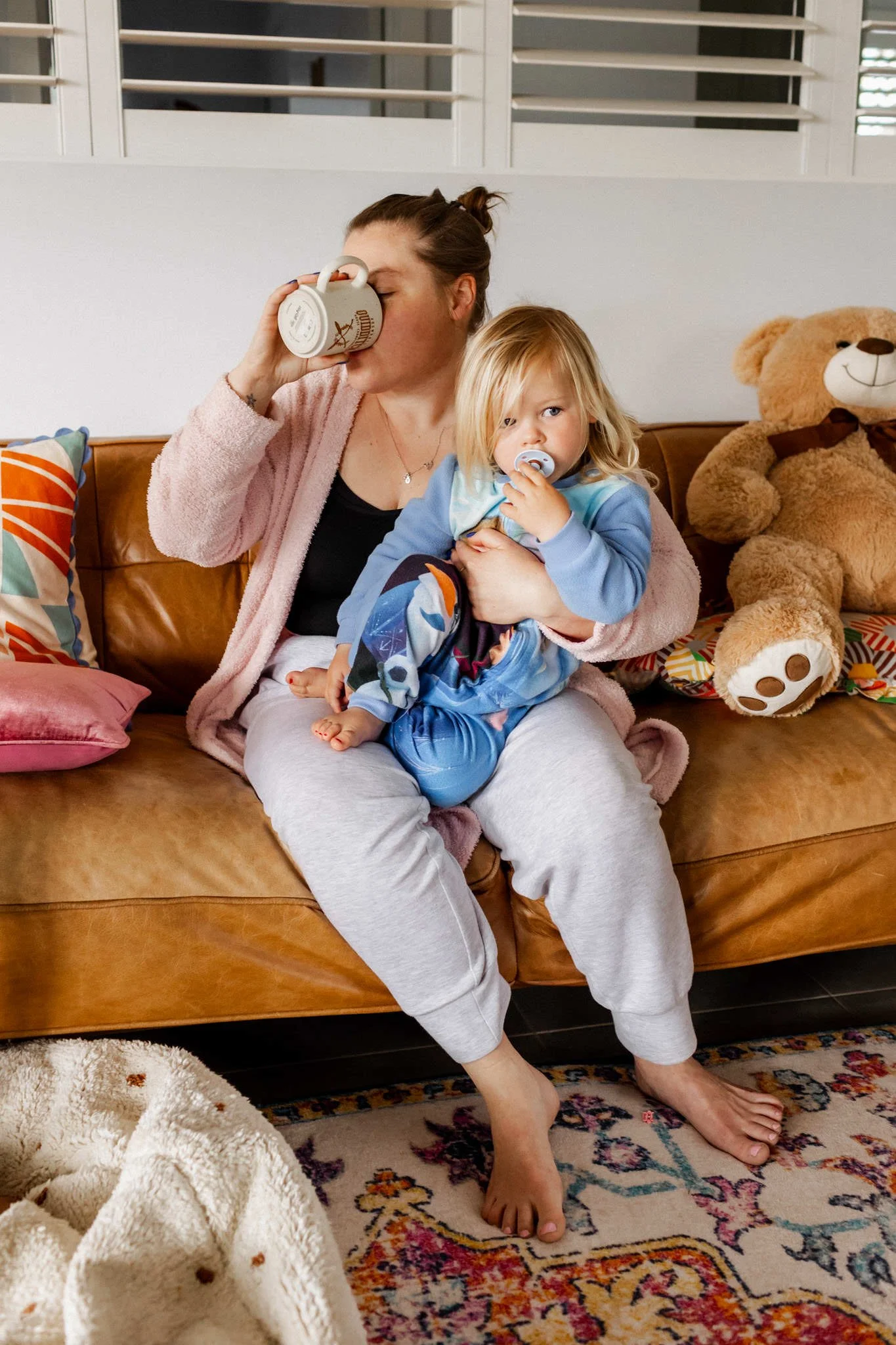 mother drinking coffee with toddler.jpg