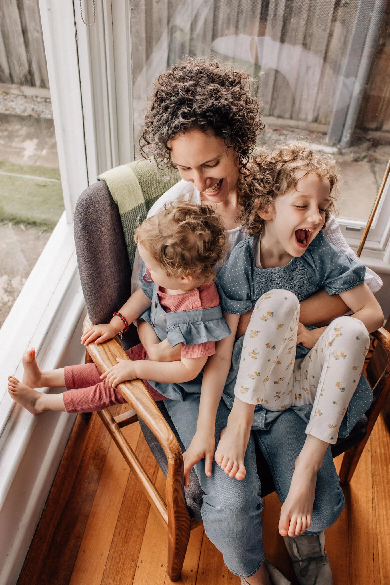 mother and daughters in window seat geelong home.jpg
