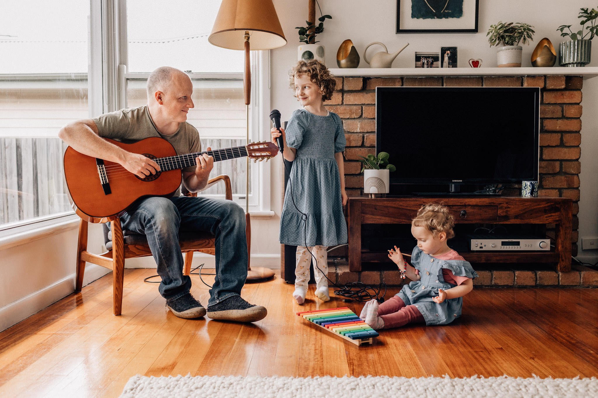family playing musica instruments in living room.jpg