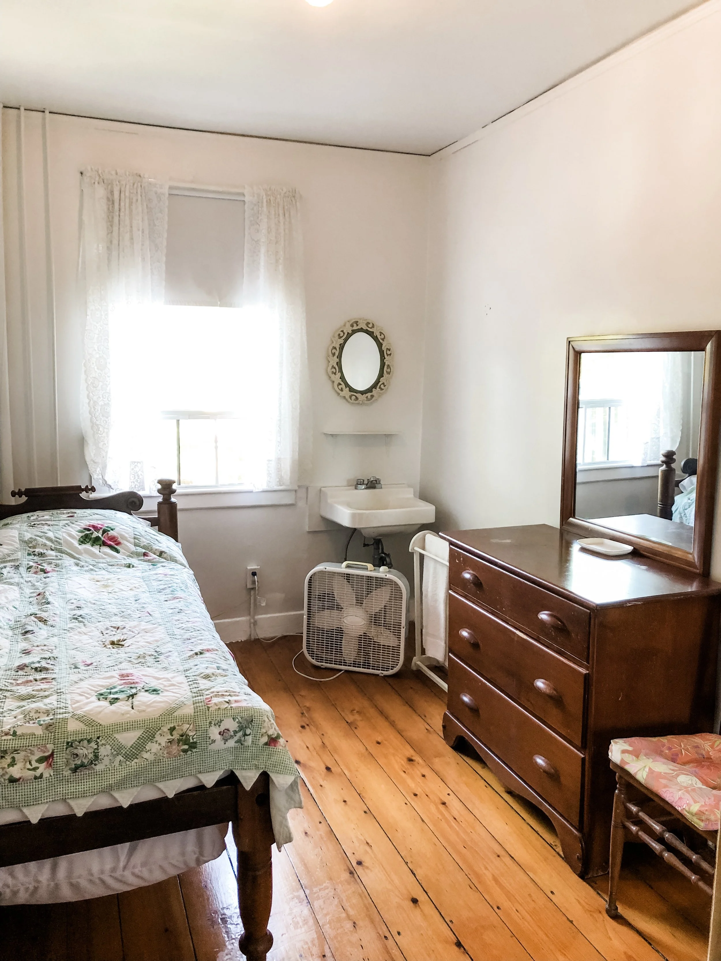 Quaint guest rooms come with box fans; bathrooms are shared