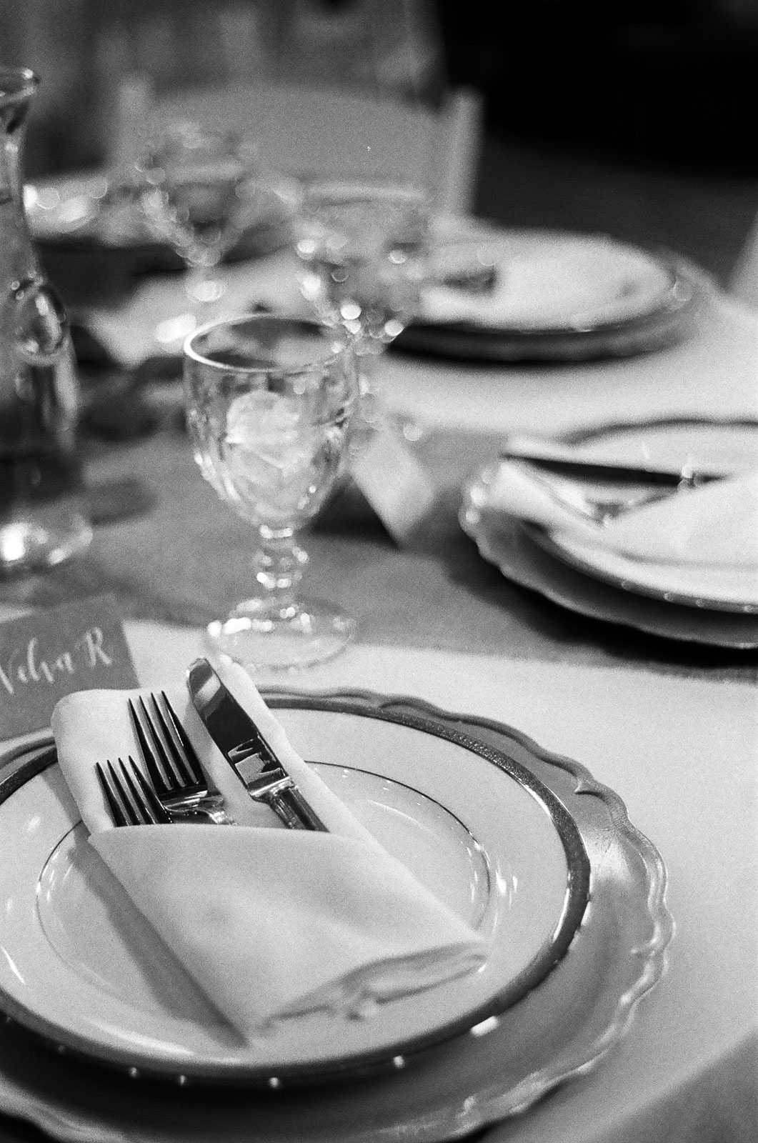 black and white 35mm film Photograph of Guest dinner table setup Details taken by Joseph Barber wedding photography newport beach