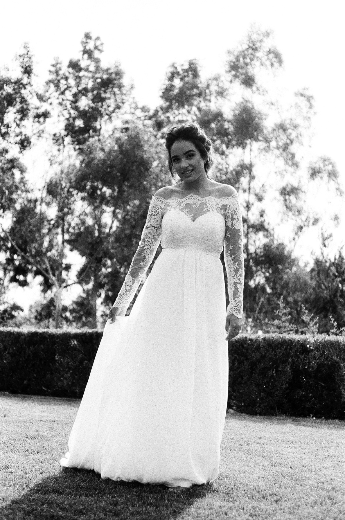 black and white 35mm film photograph of bride Posing in her wedding dress Before the ceremony taken by Joseph Barber wedding photography newport beach