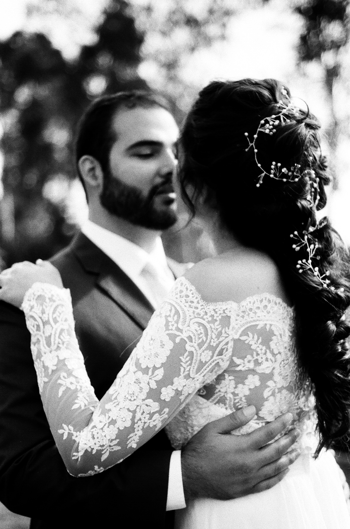  black and white photograph of bride and groom Embracing each other Before the ceremony taken by Joseph Barber wedding photography newport beach