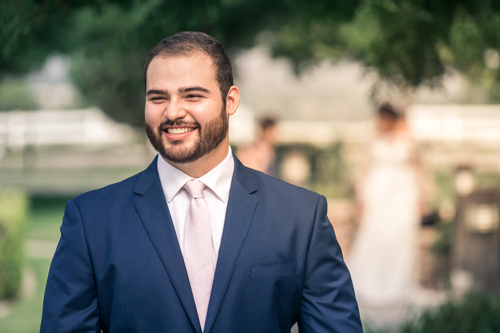 Portrait of groom waiting and  Anticipating His bride On their wedding day for the first look in Brea California