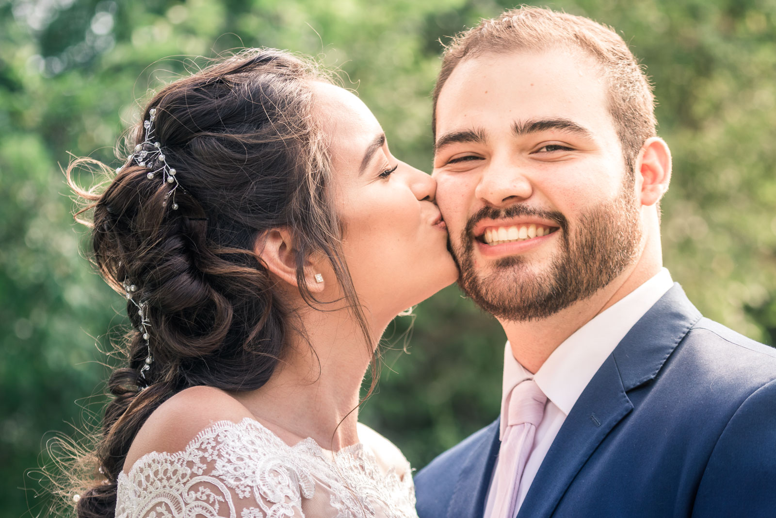 Portrait of the Bride and Kissing and smiling   during the first book on their wedding day in Brea California