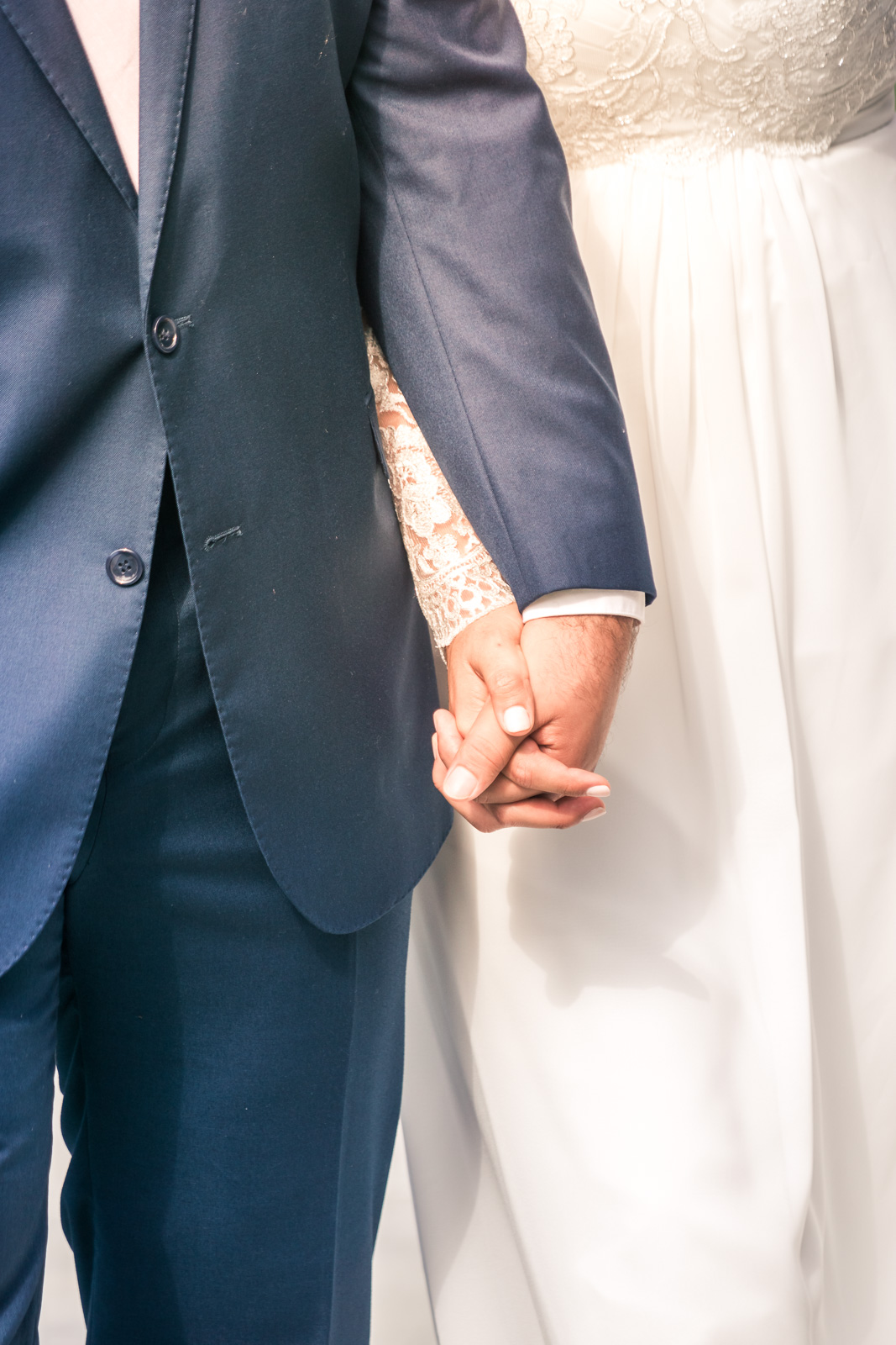 Portrait of the Bride and Holding hands and smiling   during the first book on their wedding day in Brea California