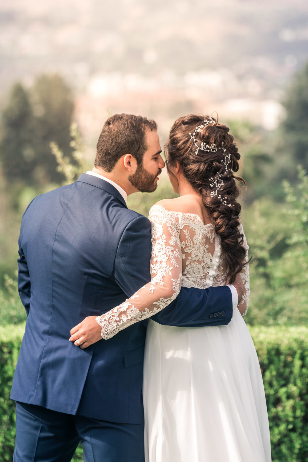 Portrait of the Bride and Kissing and smiling   during the first book on their wedding day in Brea California