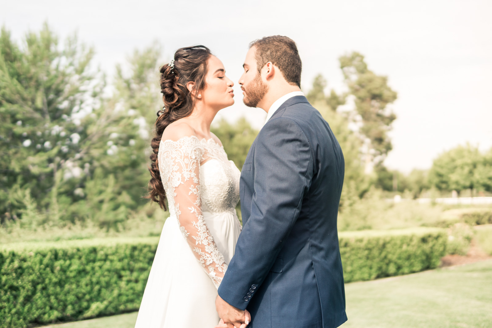 Portrait of the Bride and Holding hands and smiling   during the first book on their wedding day in Brea California