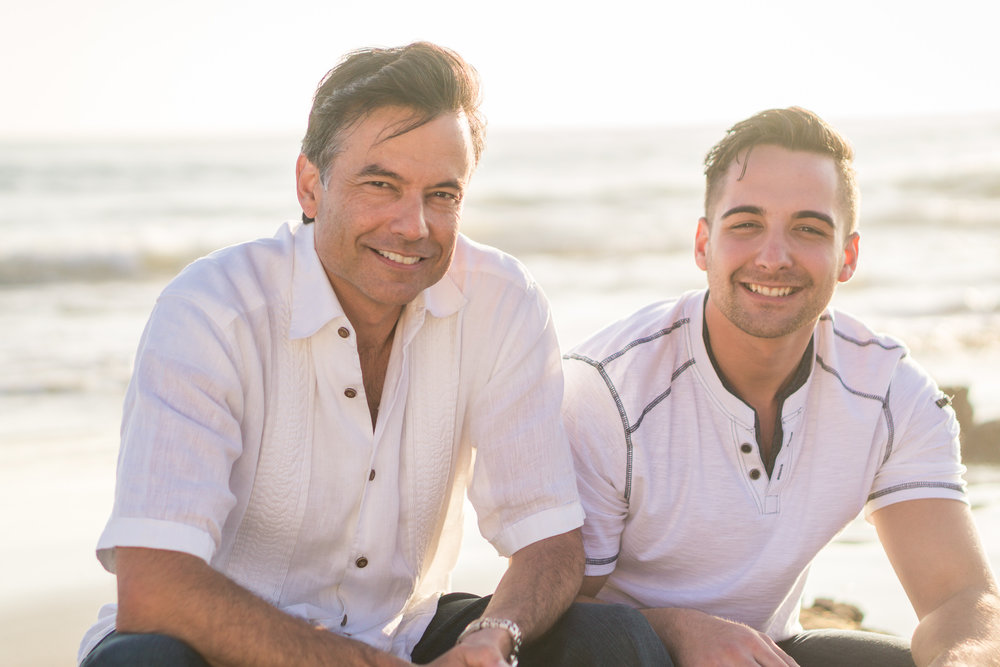 Family portraits  Of Father and son being backlit during Golden hour at Crystal Cove State Beach in Newport