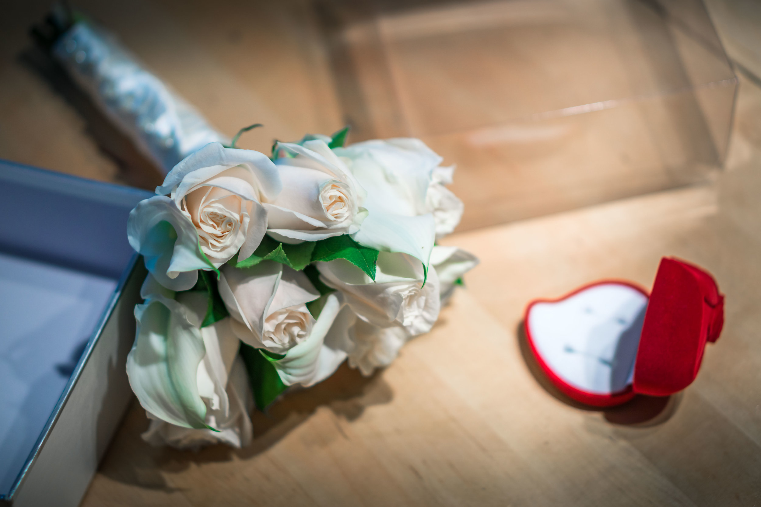 Brides bouquet and wedding ring On a table before the wedding ceremony