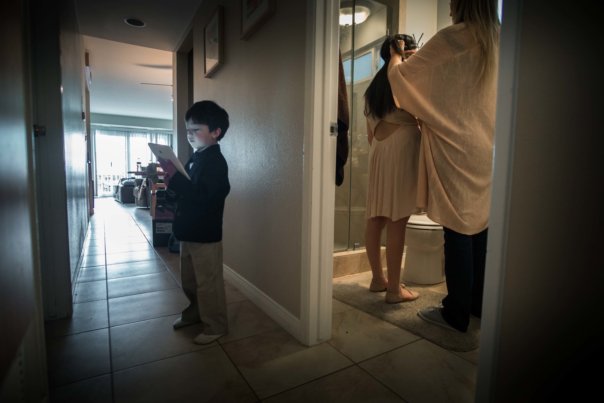 The little boy whose the ring bearer And the bridesmaids getting ready and waiting before the wedding ceremony on Balboa Island