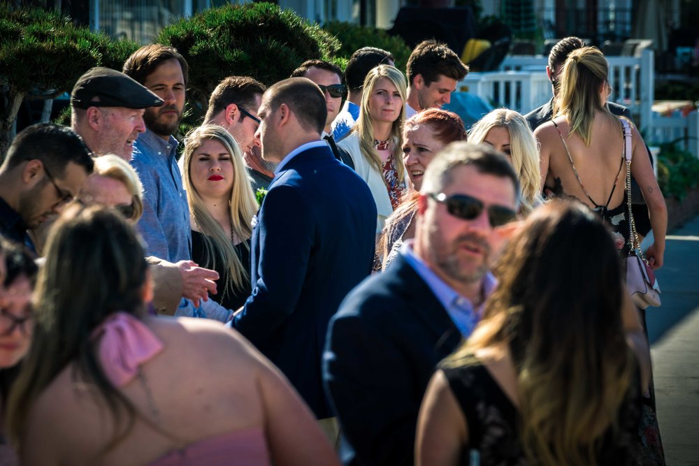 The wedding party guest chatting and laughing before the wedding ceremony