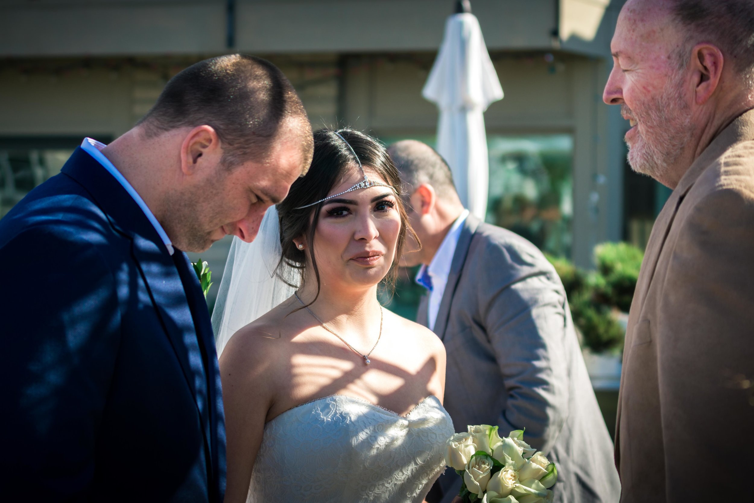 Bride and groom being married by The pastor at the altar During your wedding ceremony On diamond street on Balboa Island