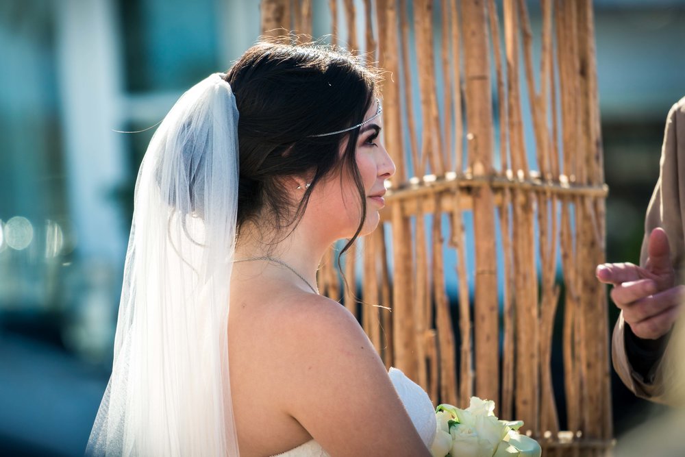 The bride with her veil at the alter