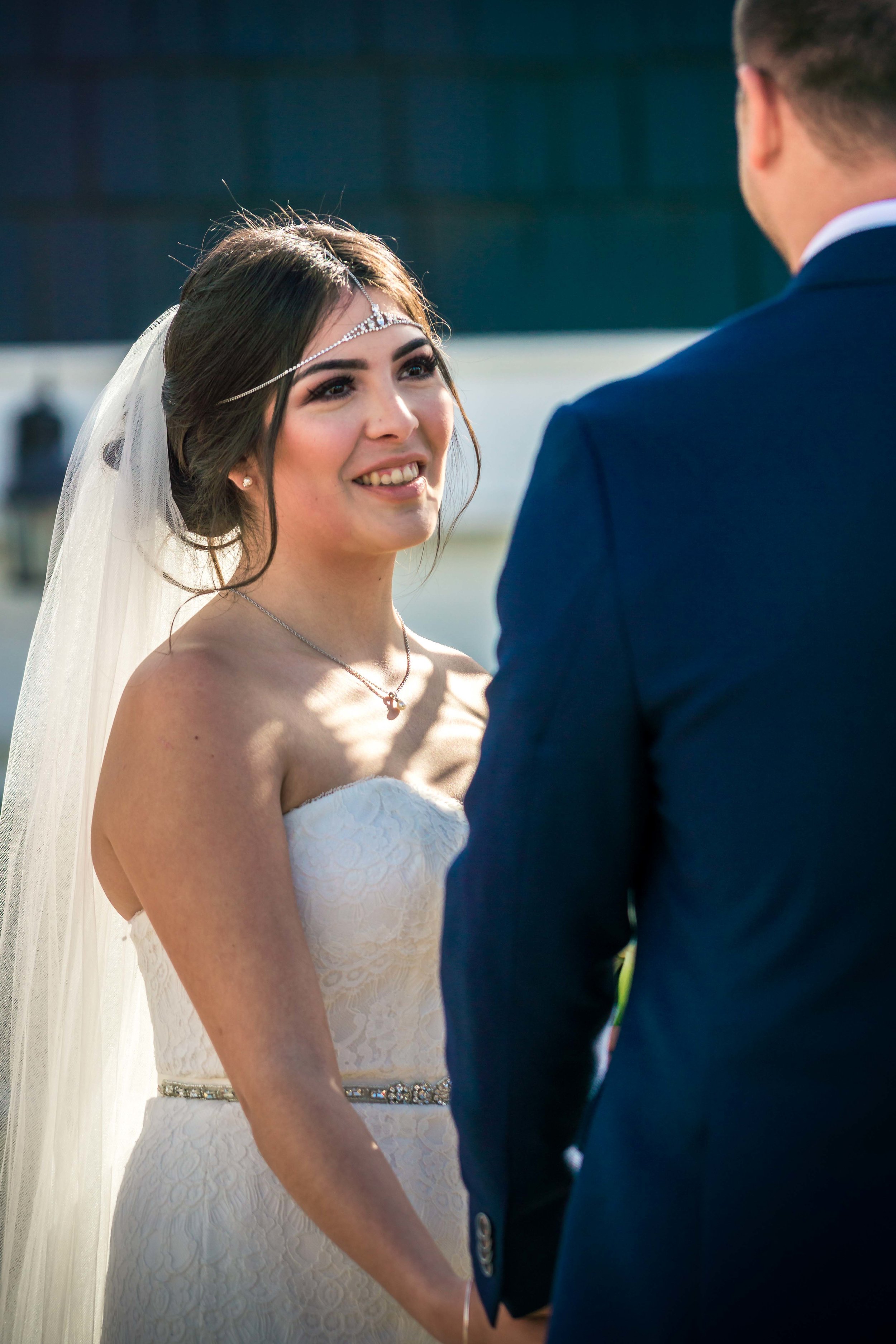 The bride and groom looking at each other in love at the altar during their wedding ceremony in Balboa Island