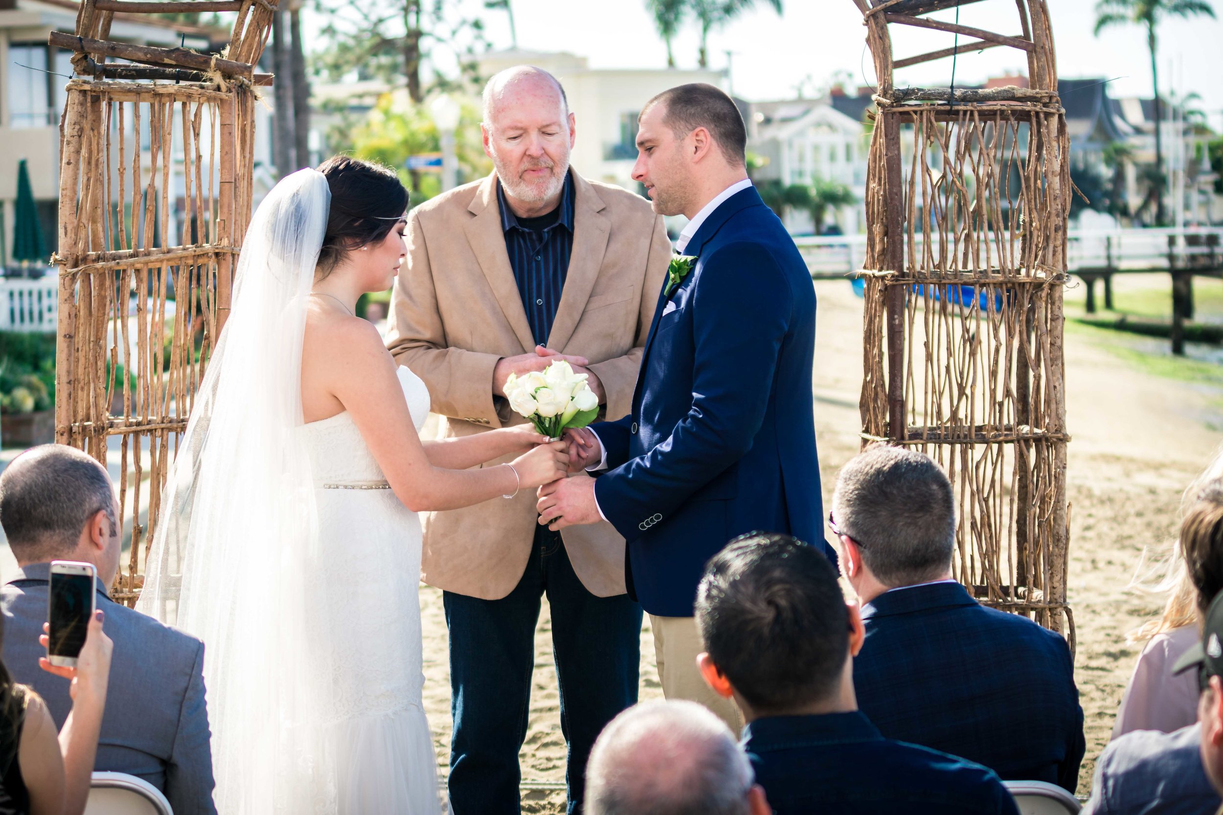 the bride and  groom been married by the pastor at the altar