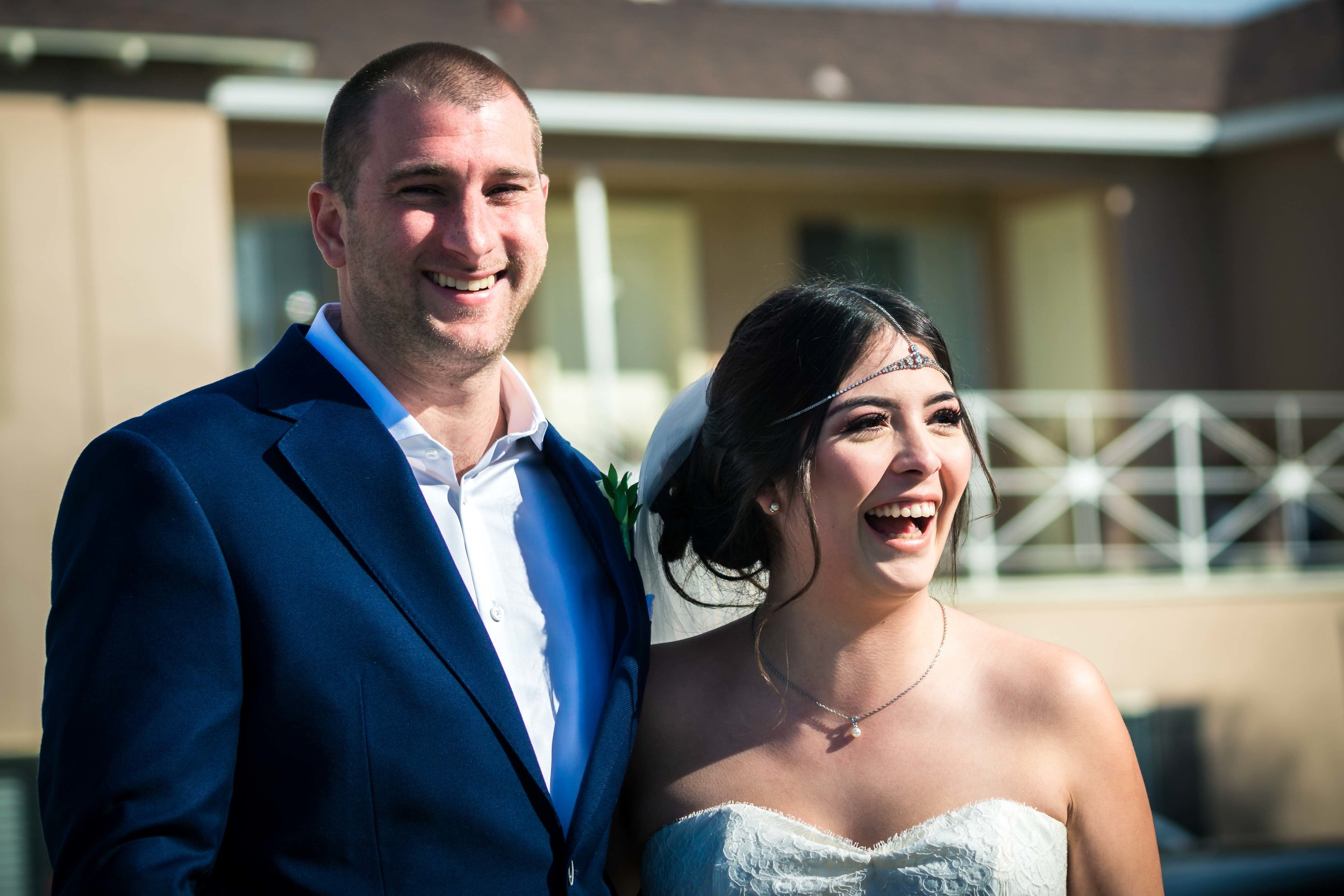 Bride and groom laughing together