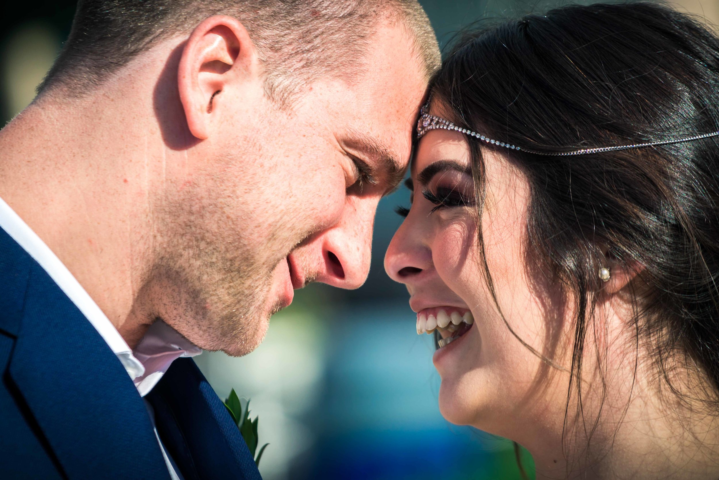 The bride and groom laughing