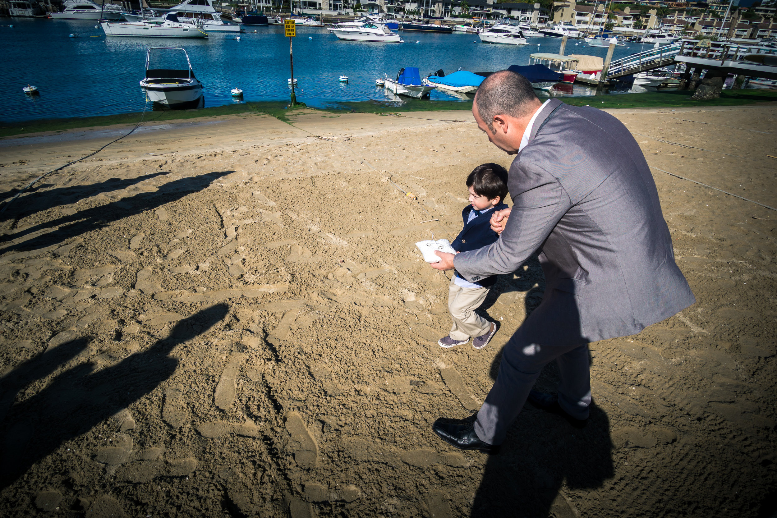 Father giving the ring to the little boy ringbearer ceremony