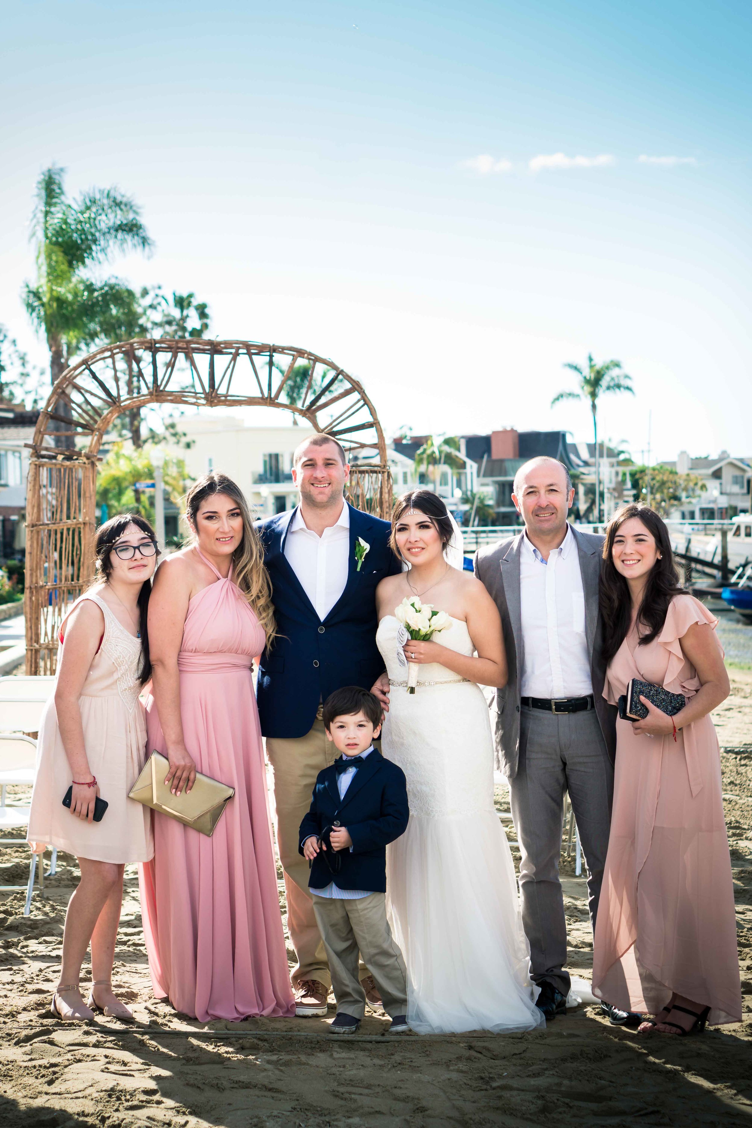 Family portraits of the bride and groom with her family