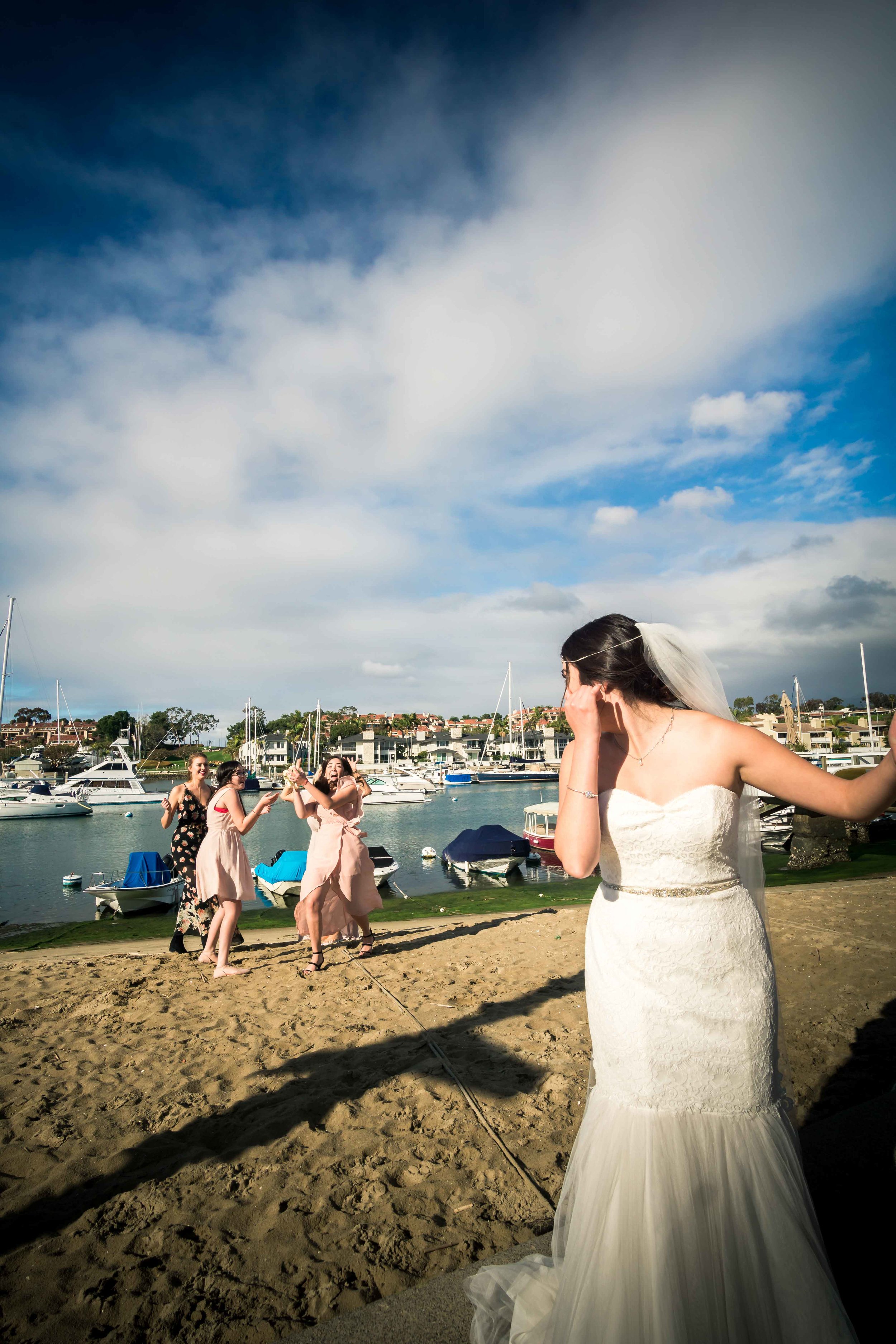 The bride tossing bouquet To the bridesmaids And single ladies