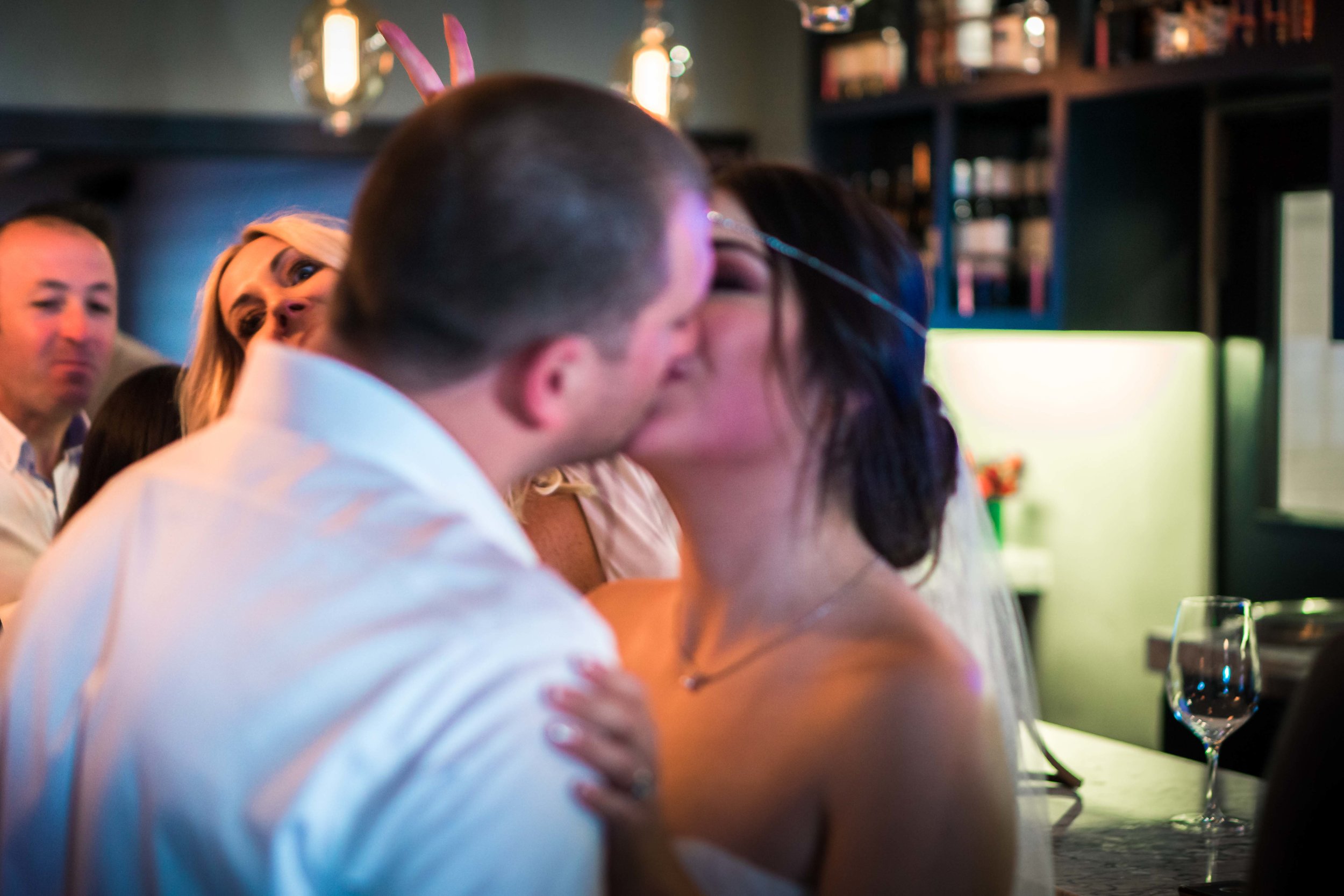 Bride and groom kissing