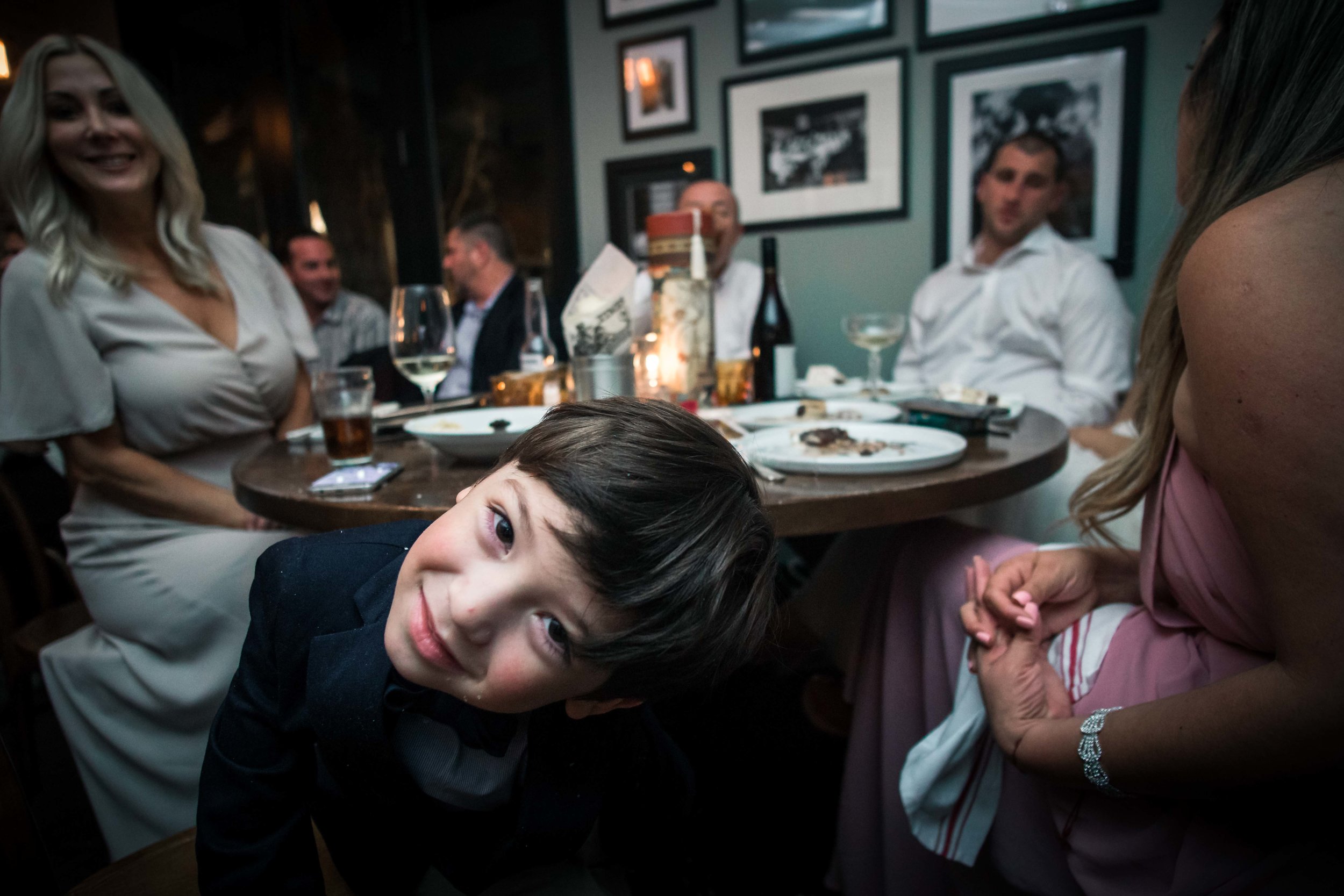 Funny photo of the ring bearer during the reception