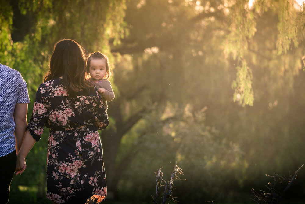 Candid family portrait of little girl looking back During a Photo shoot Taken by Joseph Barber photography
