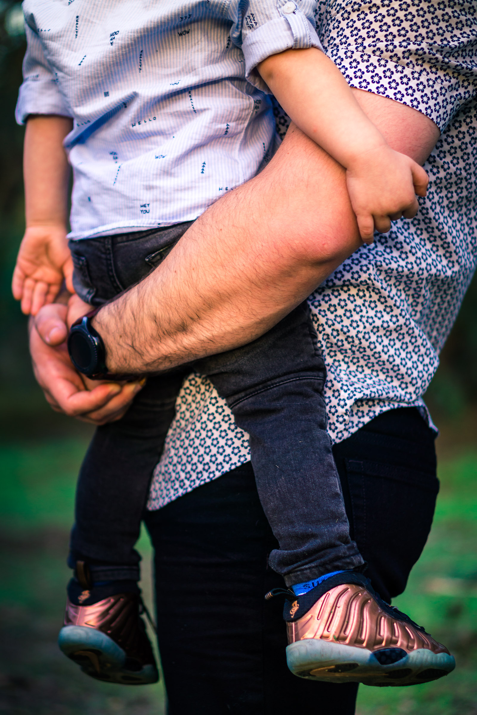 photo of a  father holding his little boy during a family portrait session  on the juanita cooke trail in fullerton orange county taken by joseph barber photography