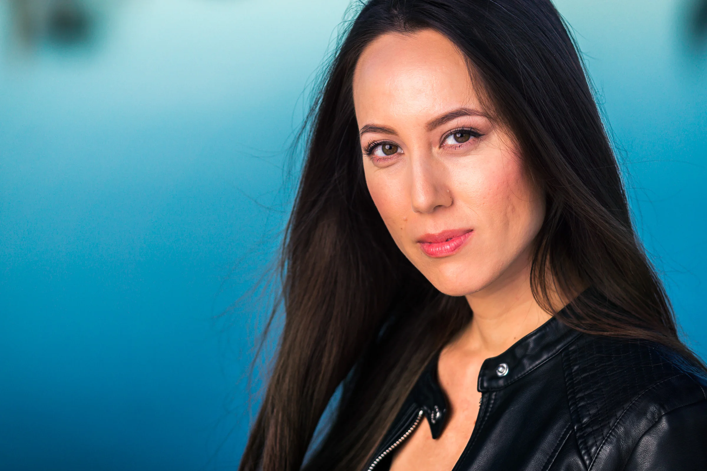 Professional headshot of Amy taken in newport beach with off camera flash and natural light