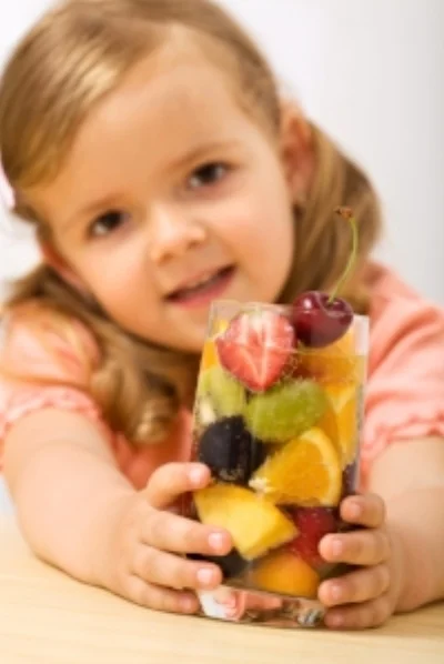 Girl with glass fruit.jpg