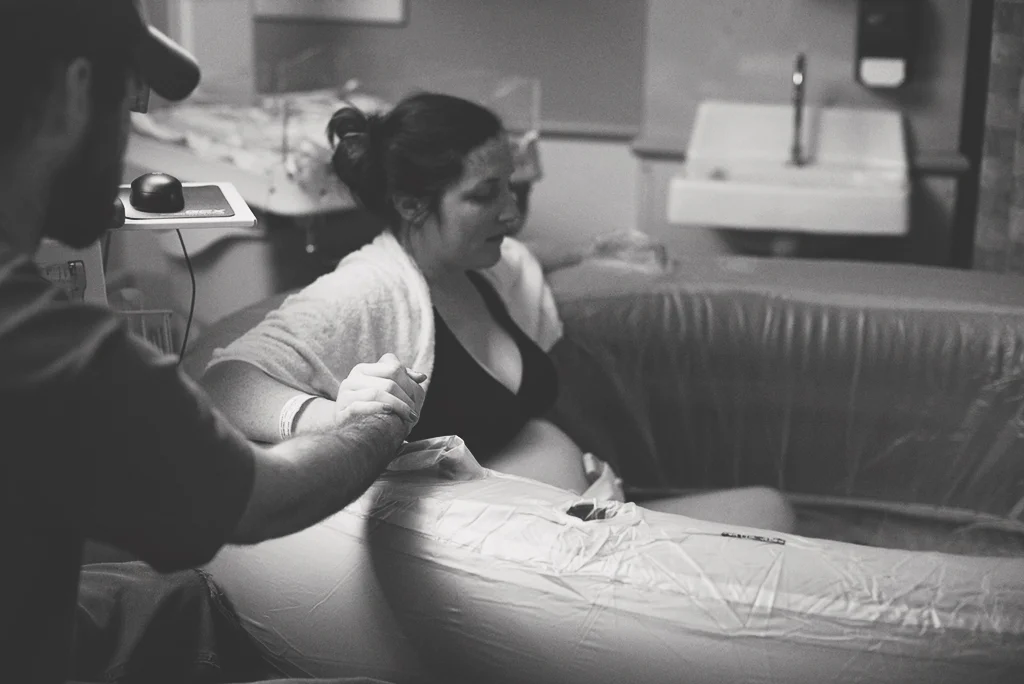 mom labors in pool during delivery.jpg