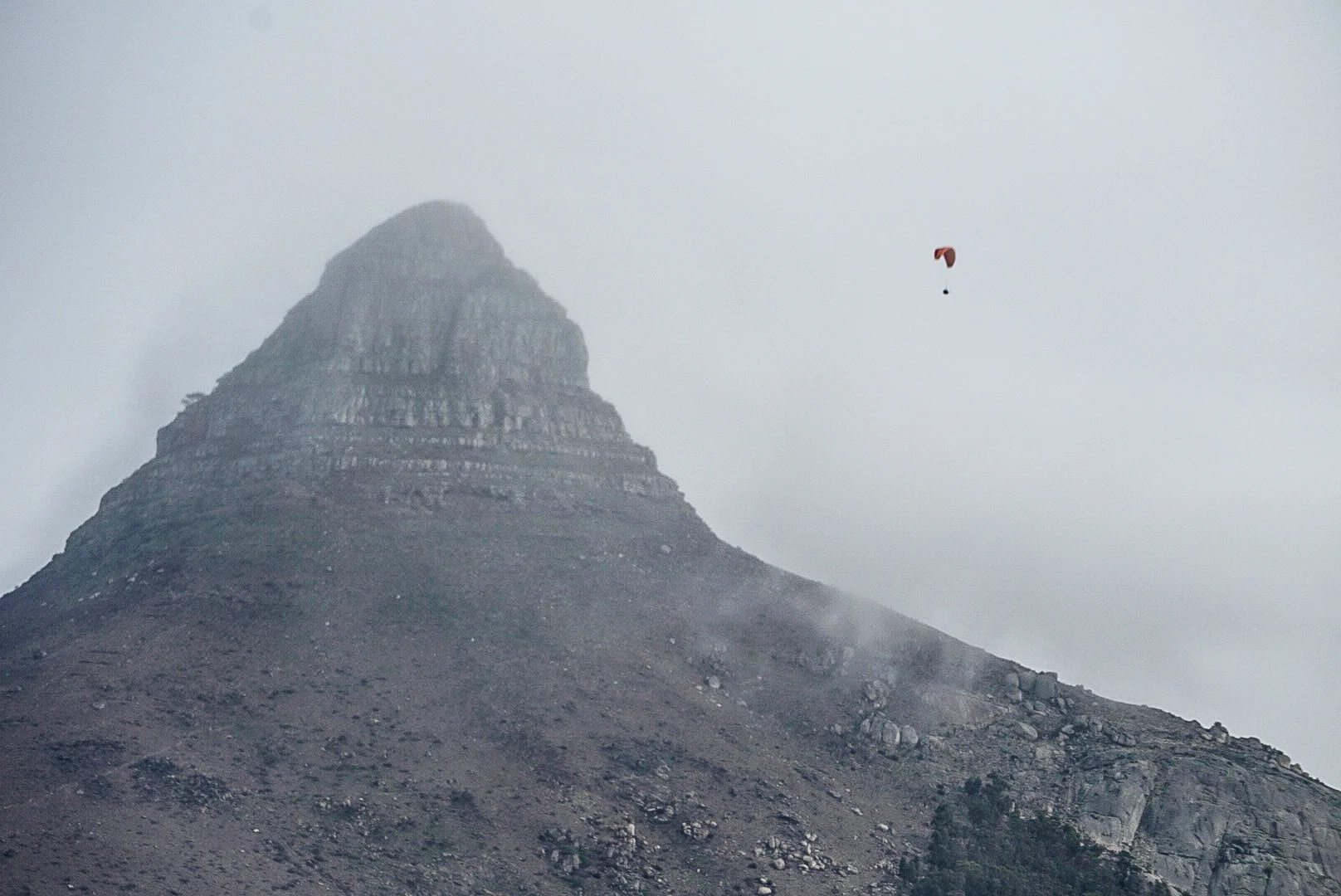Paragliders soar above the city most afternoons