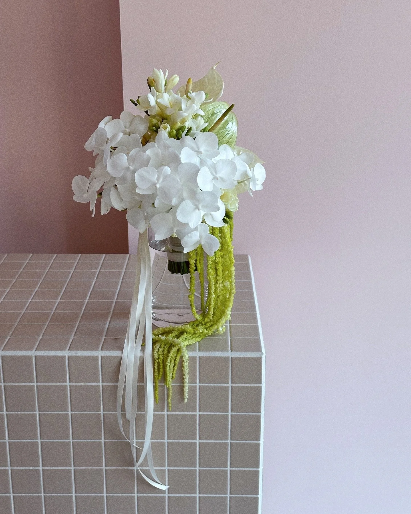 Damn, I hate to brag, but all my bouquets baddies. 

Farrer&rsquo;s Bouquet: 
Curated from a base of hydrangea, dressed with groupings of fragrant freesias, finished with a waterfall of petite phalaenopsis orchids, mixed anthuriums varieties and trai