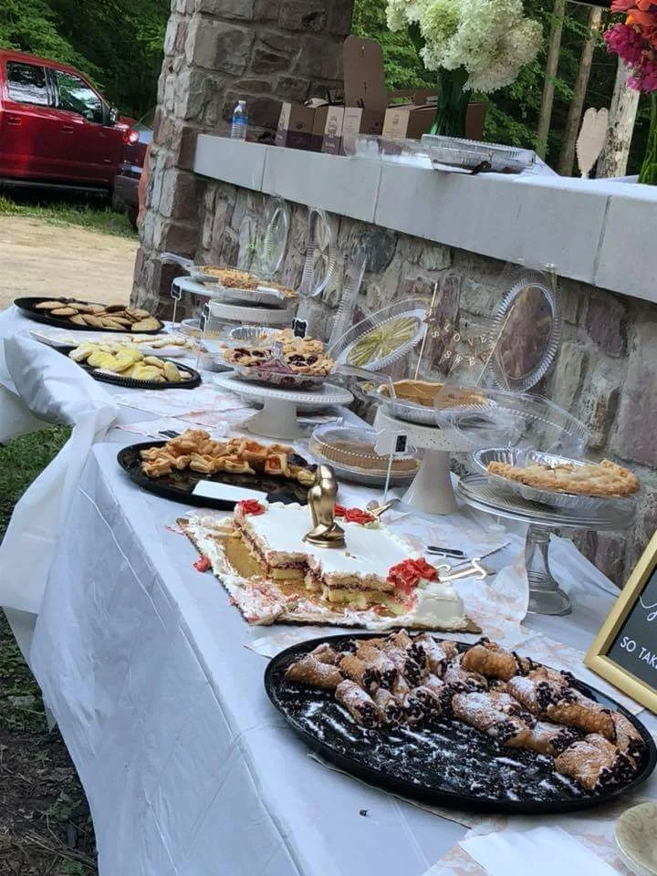 The home made food after it had been hit by a few of our guest. (The cake was store bought)