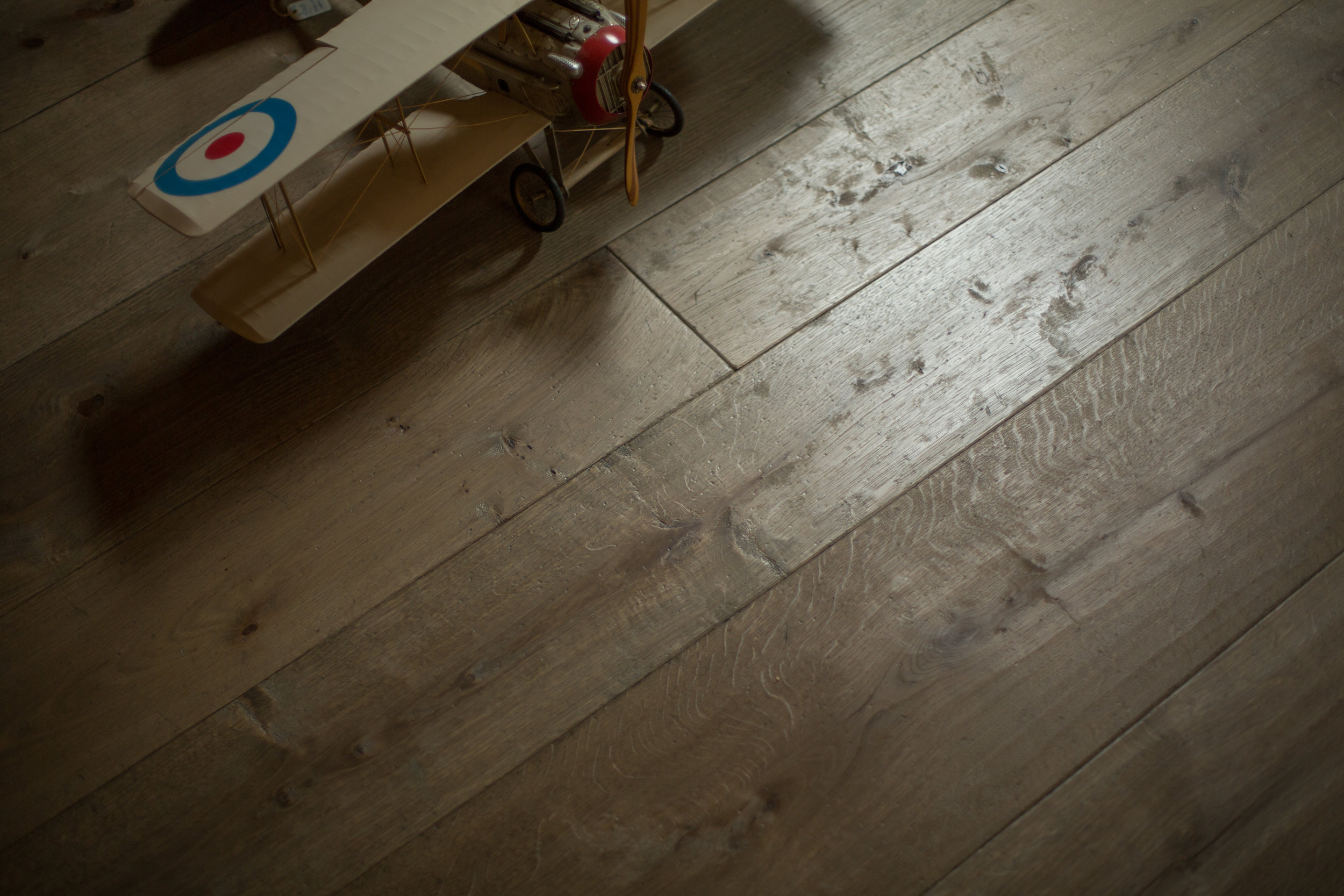 Wide plank distressed wood flooring