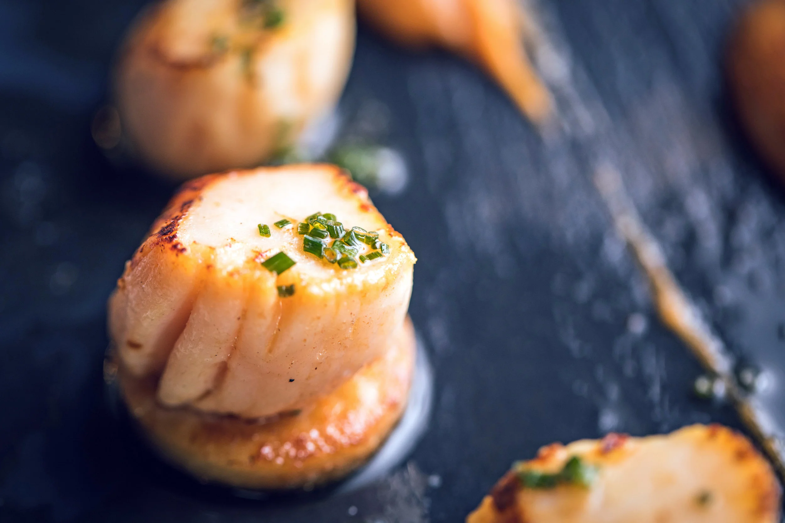 Scallops , perfectly seared in plenty of butter