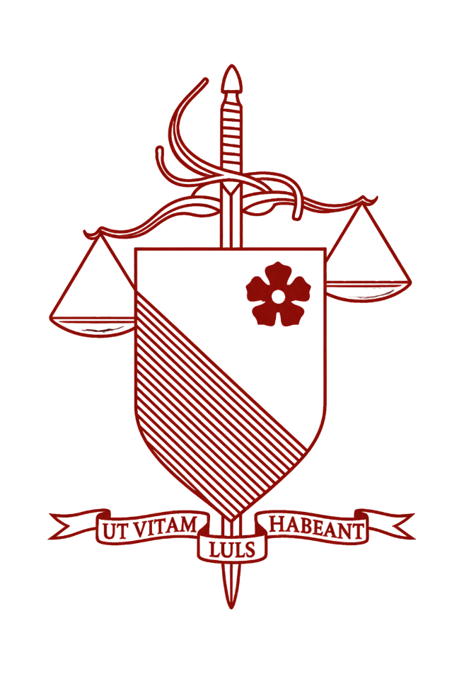 A red line drawing of a heraldic shield with a flower on the upper right; a diagonal pattern on the lower left; a sword behind the shield with a ribbon banner underneath reading 'UT VITAM HABETANT LULS'; and a balanced scale emerging from the top of the shield.