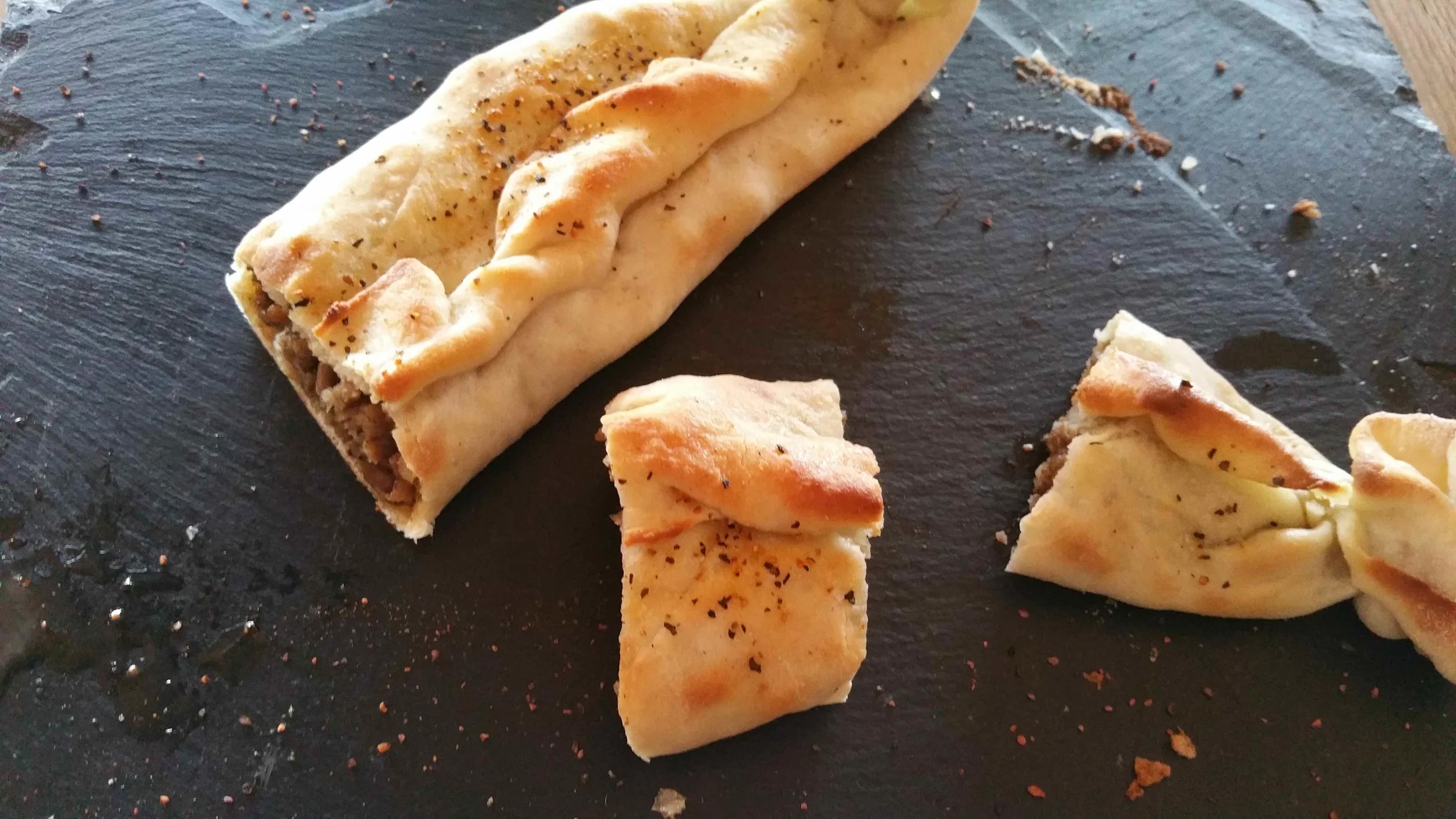 The Harrison Charcoal Oven pide contains spiced lamb, paprika and cloves