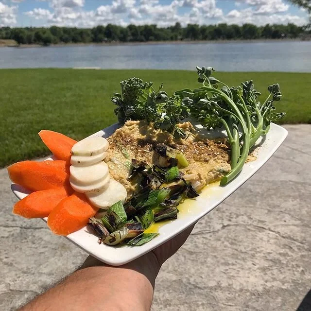 Our beds over in the Fort Pierre Community Garden have started producing &amp; we couldn&rsquo;t be happier to bring back the fresh locally grown goodness!! 🥕👨&zwj;🌾 Get in this week for Grilled Leek Hummus w/Fresh Local Crudite&rsquo; supplied by