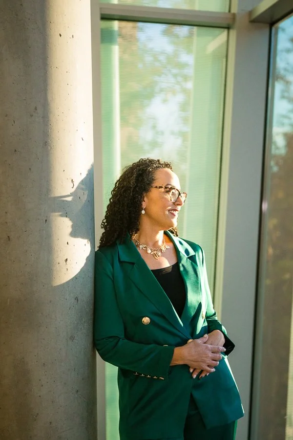 Cherri McKinney looking out of a window in profile