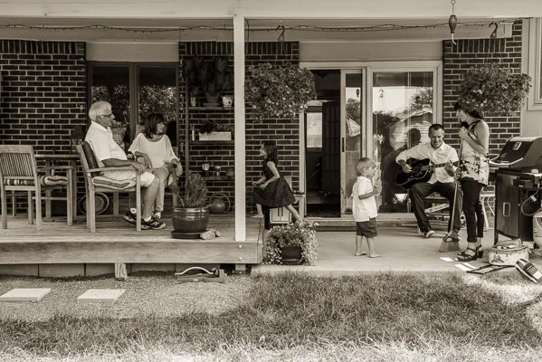 Family hanging out on the back porch.
