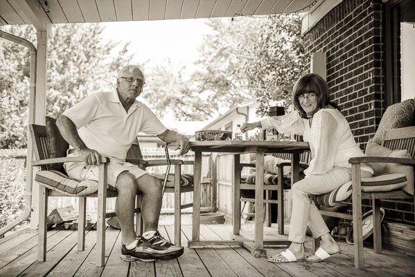 Grandparents at a picnic table.