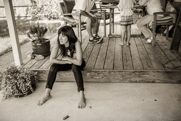 Woman hanging out on her porch.