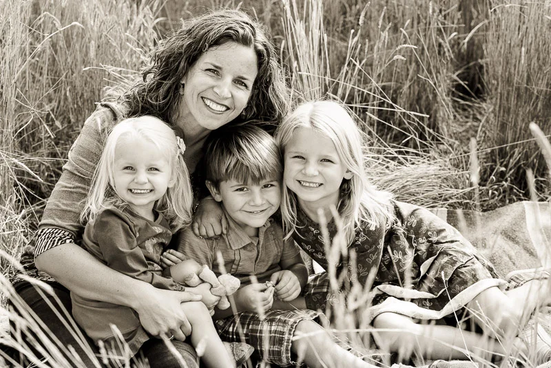 Black and white fall family photos in Carbondale mom with three kids.