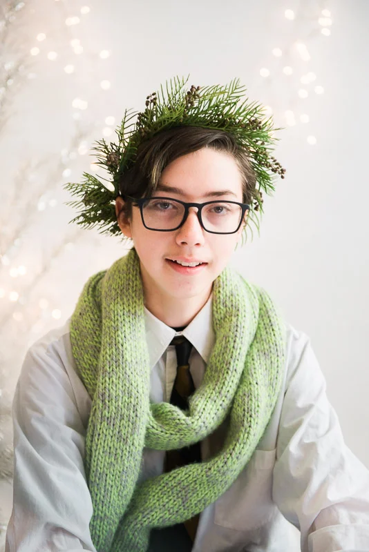 studio session boy wearing christmas crown and scarf