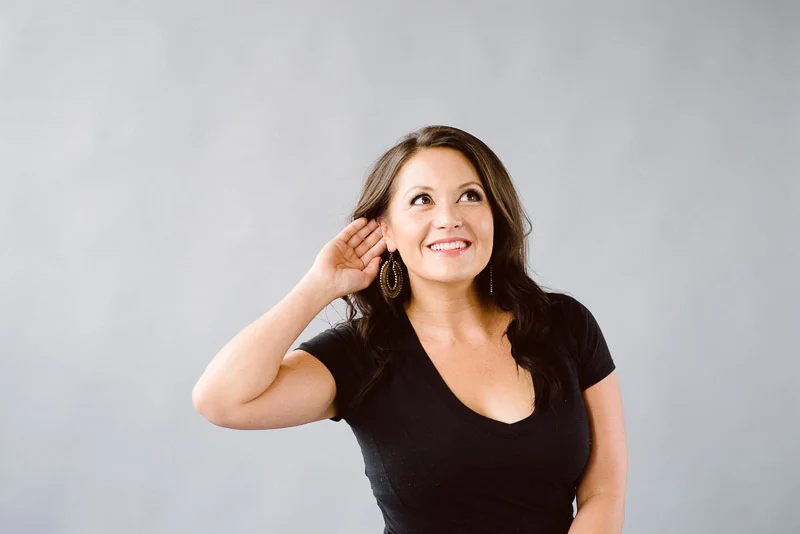 Woman demonstrates listening for feedback from a client.